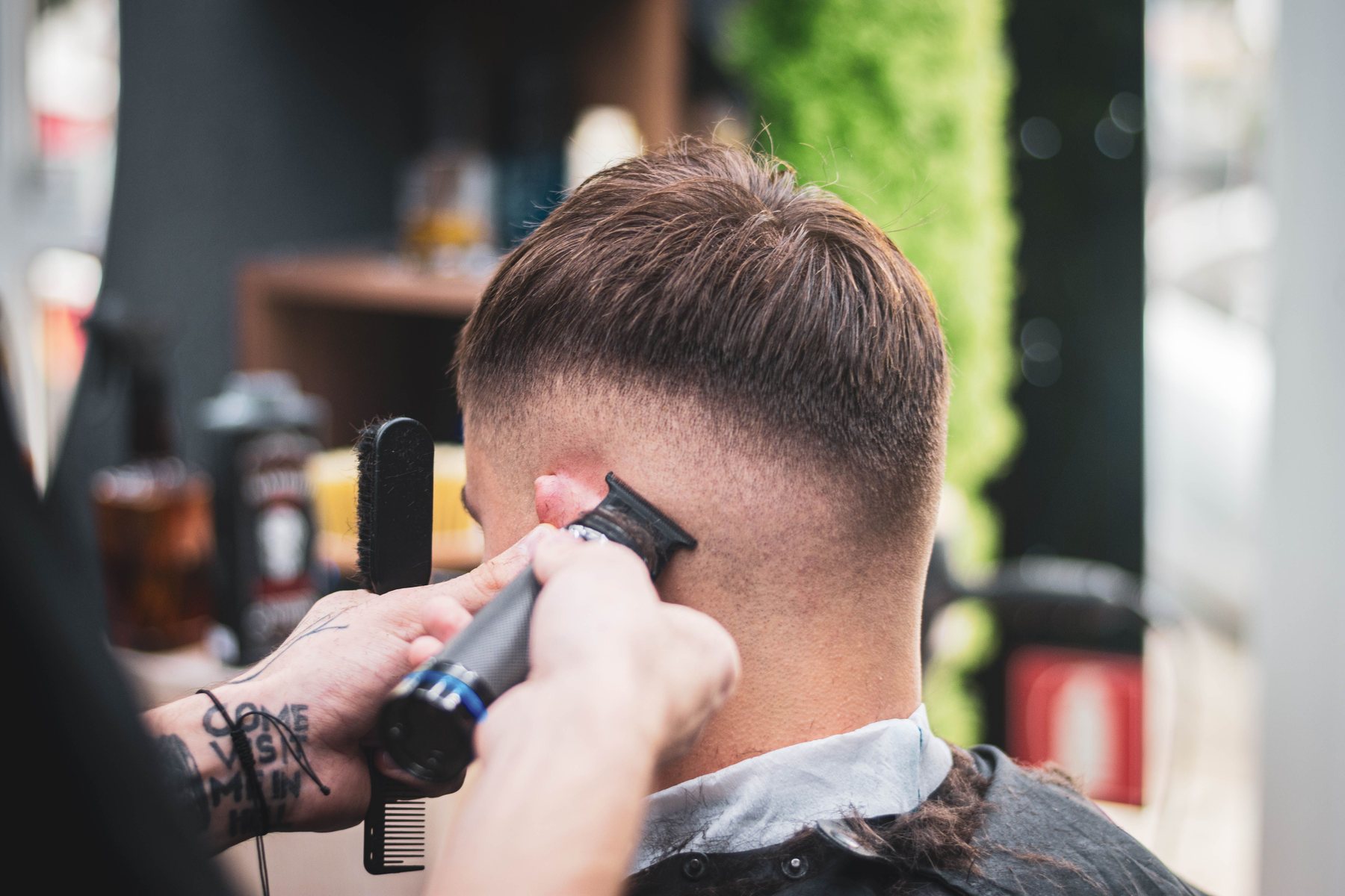 Clipper and razor detail shaping a beard line