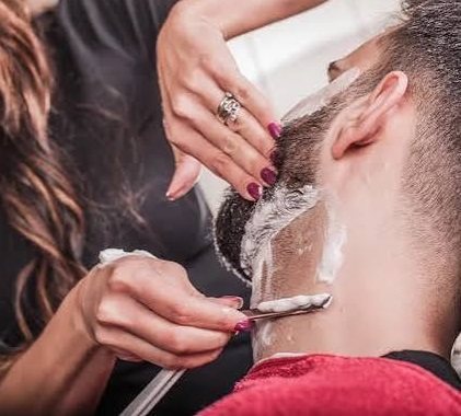 Razor line up along the neck with shaving cream